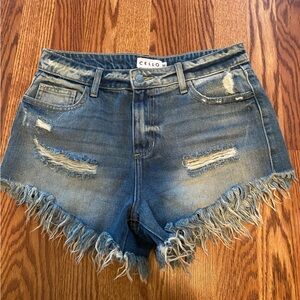 Cello brand distressed denim shorts with fringe bottom. Size medium.